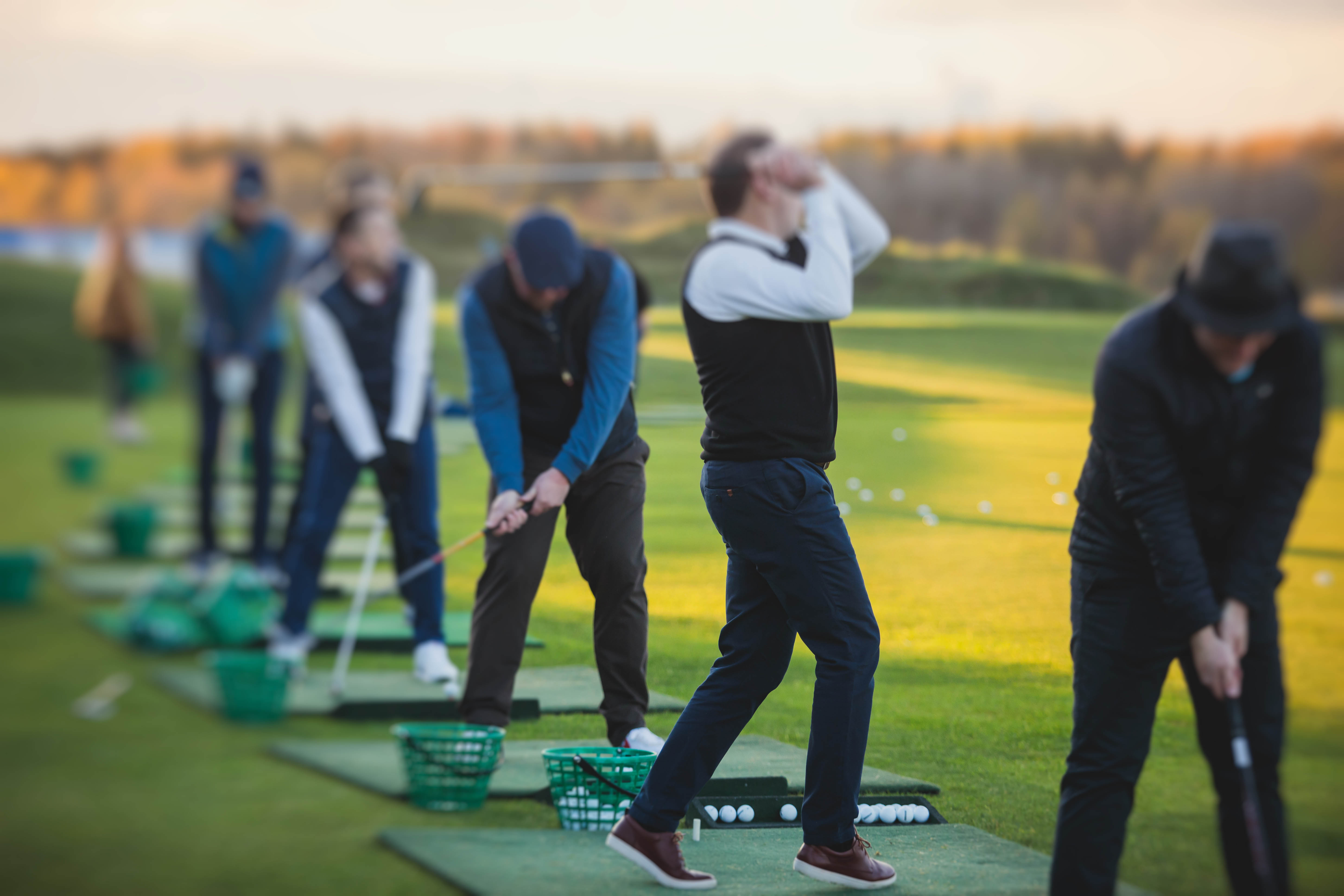 Group at the driving range on the golf course